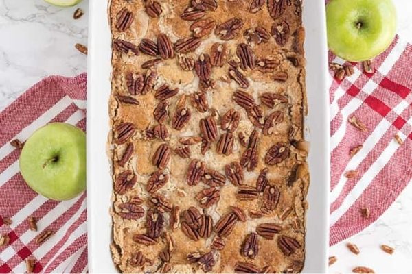 Full caramel apple cake in a casserole dish.
