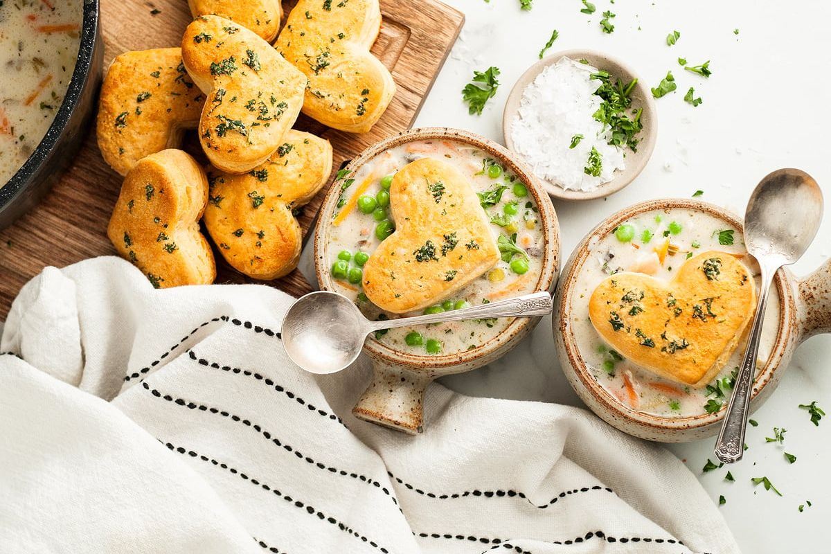 Chicken Pot Pie Soup with Biscuit Topping in two bowls.