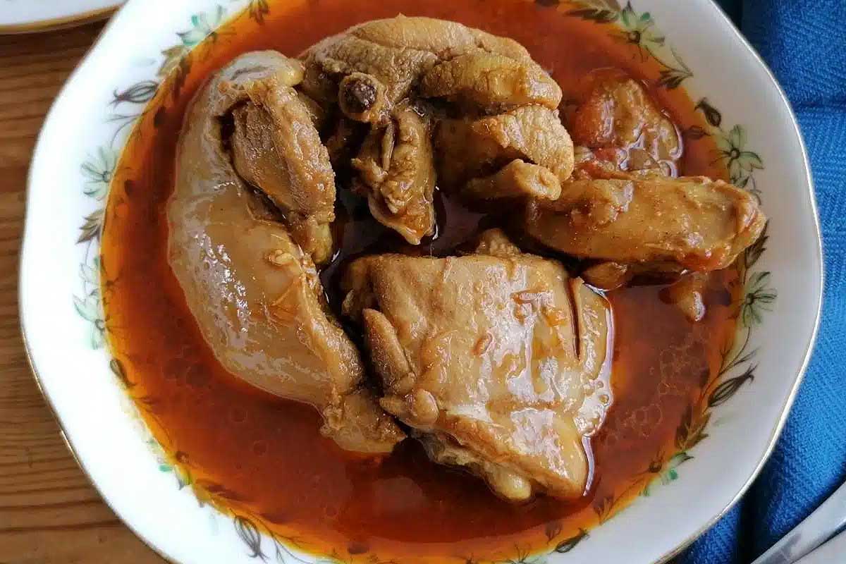 Chicken Shorba in a white bowl.