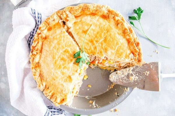 Sliced chicken pot pie on a dish.