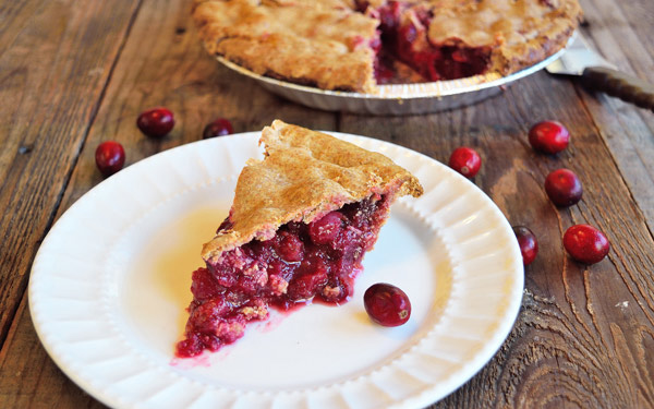 A slice of Cranberry Pie on a white plate