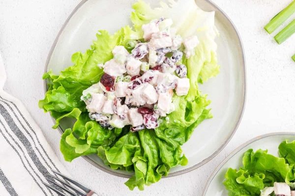 Cranberry Turkey Salad on a bed of lettuce. 