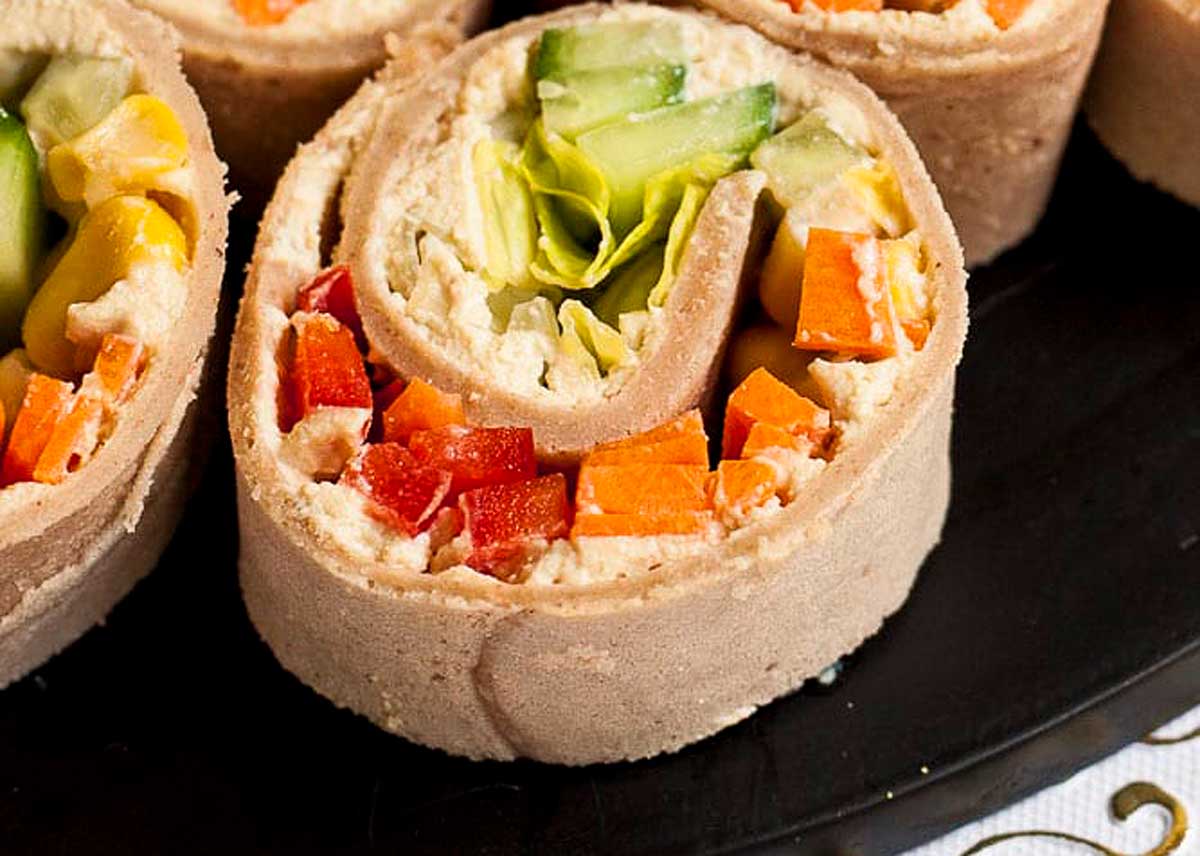 Pinwheel appetizers on a platter.