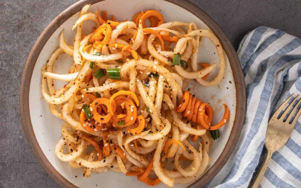 Spiralized daikon salad on a plate.