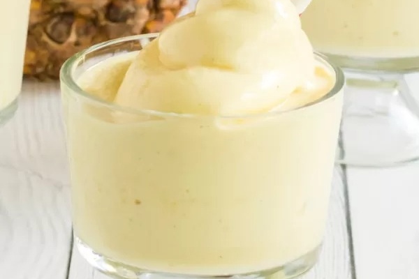 Dole Whip in a clear glass.