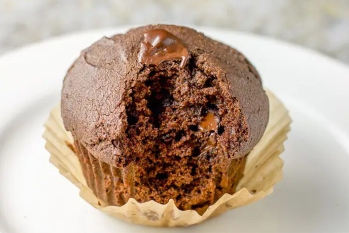 Double chocolate muffins sitting on a wire rack.
