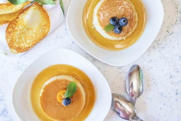 Two  plates of creme caramel dessert for Thanksgiving. 