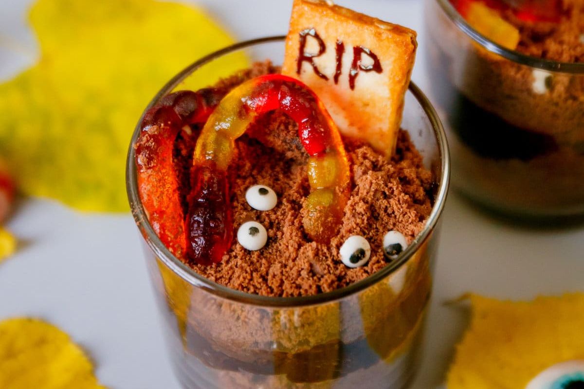 Pudding in cups with gummy worms.
