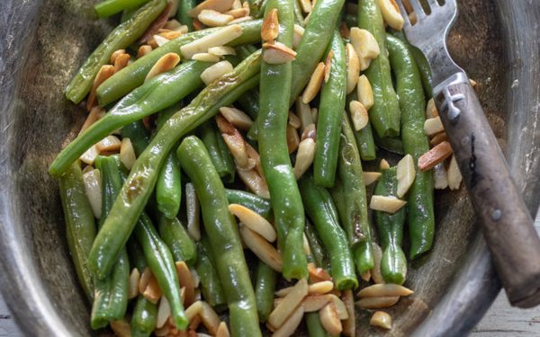 Green beans with almonds in a bowl.