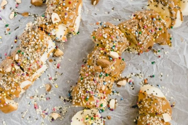 Healthy Banana Sushi Rolls with Peanut Butter on a tray.