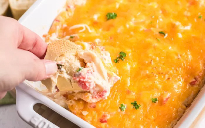 Crab dip with melted cheese on top.