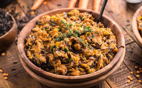 Wild rice casserole in a brown bowl.