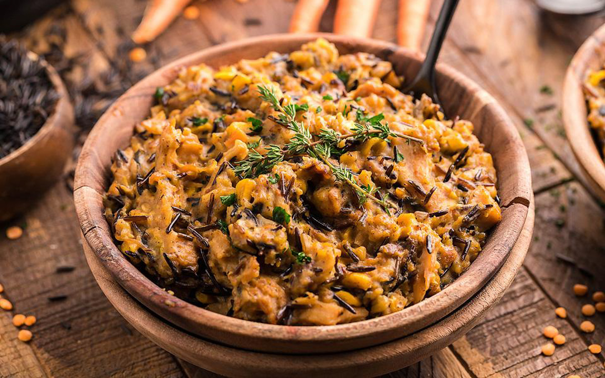 Wild rice casserole in a brown bowl.