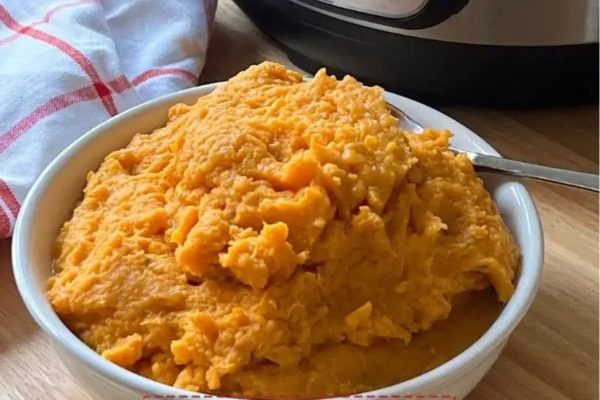 Instant Pot Mashed Sweet Potatoes in a white bowl. 