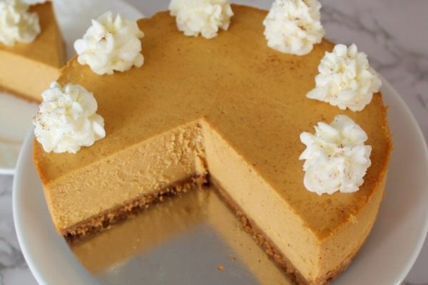 Whole Instant Pot Pumpkin Cheesecake sliced. 
