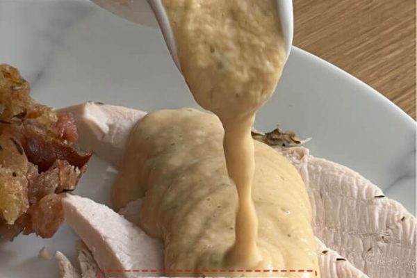 Turkey crown smothered in gravy sauce. 