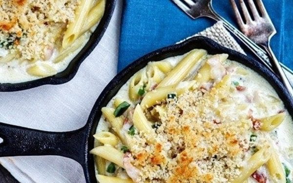 Mac and cheese in two cast iron skillets.