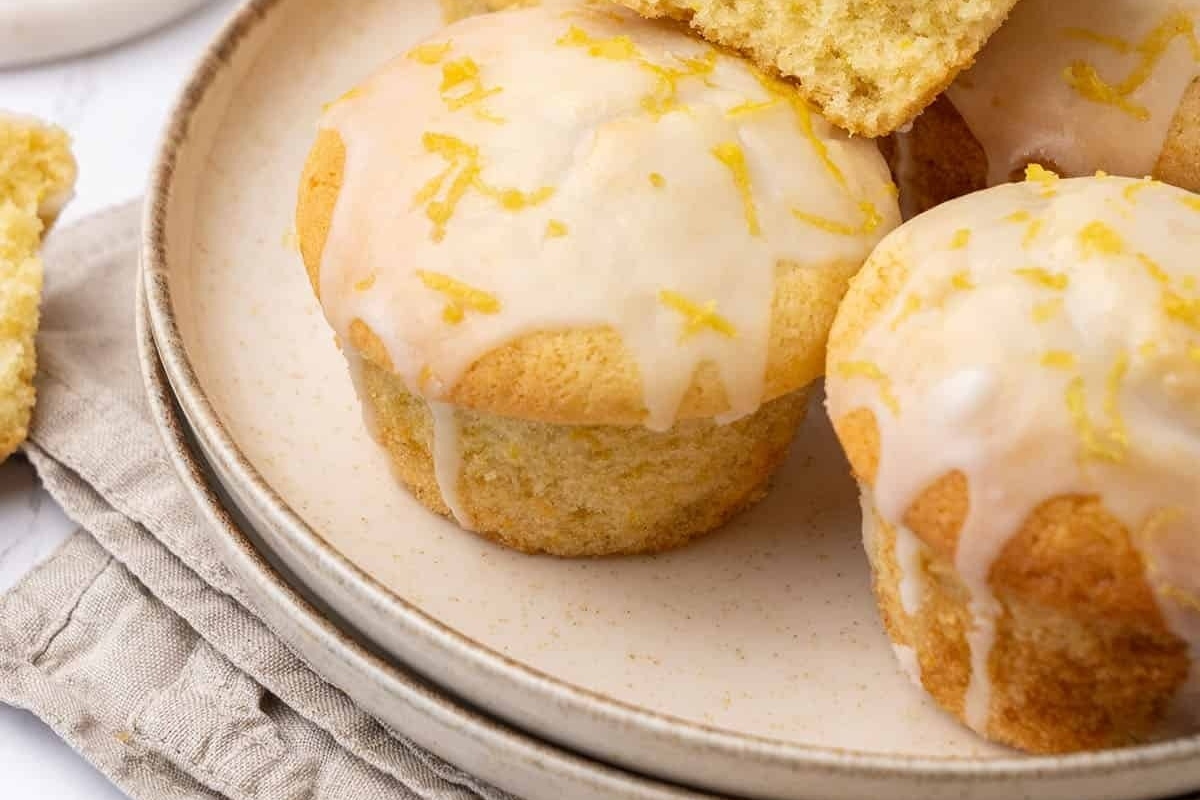 Lemon muffins on a plate.