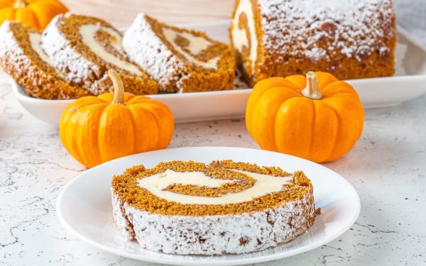 A slice of pumpkin roll on a plate