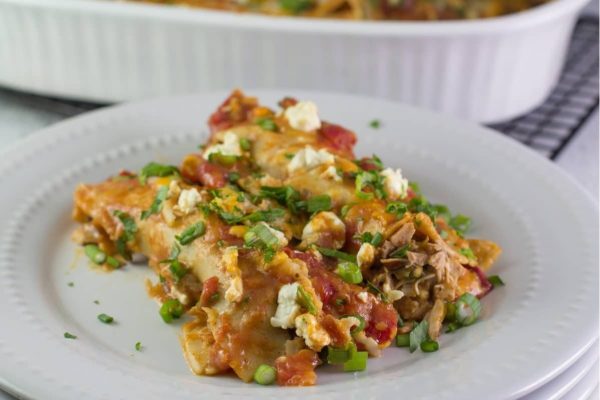 Mexican chicken enchiladas on a plate.