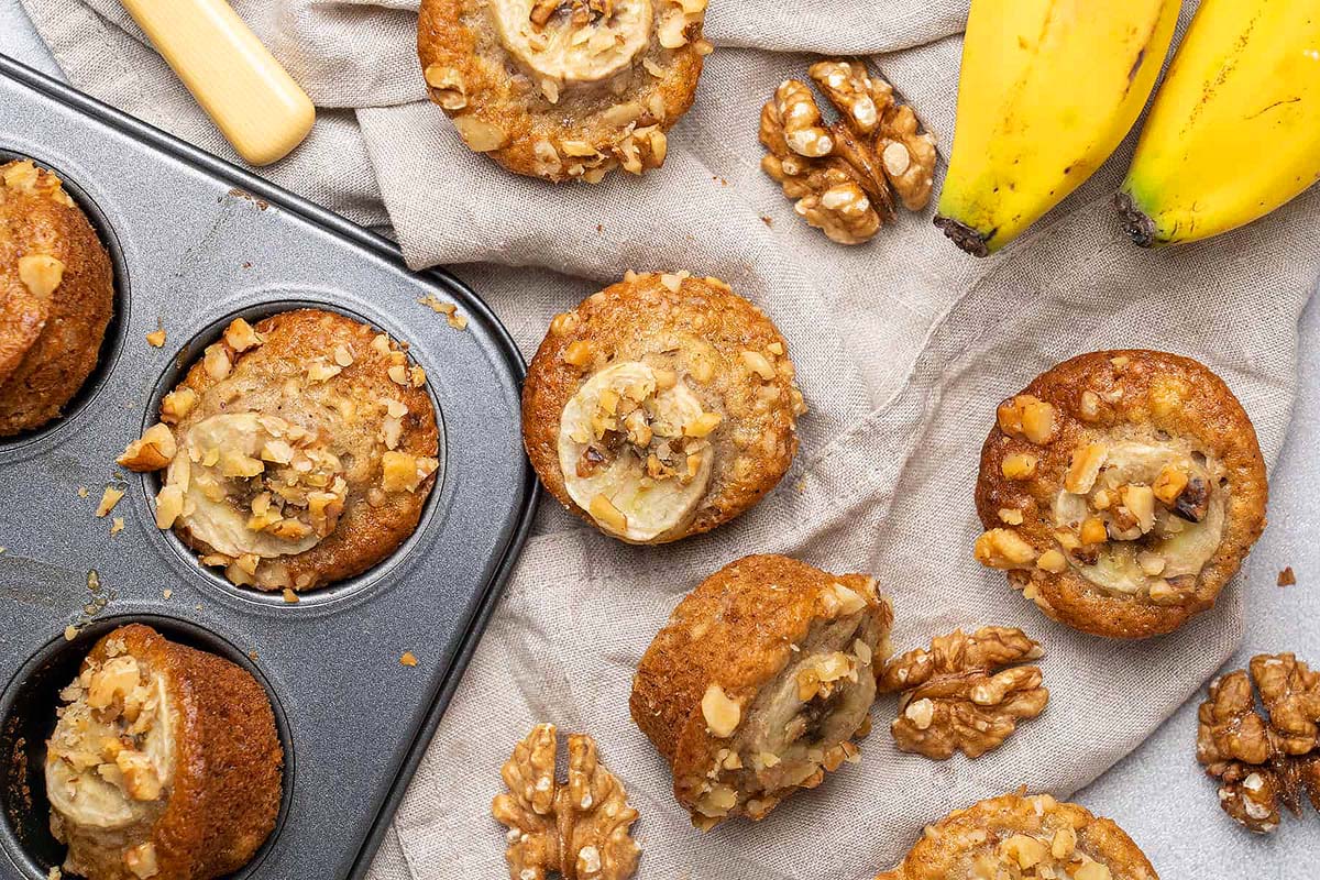 Mini banana muffins taken from the tray.