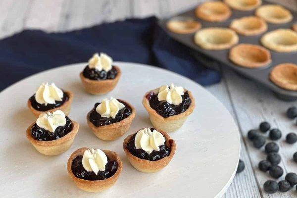 Mini Pie Crust Shells served on a white dish. 