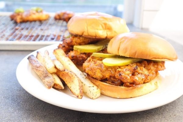 Nashville hot chicken sandwiches on a plate.