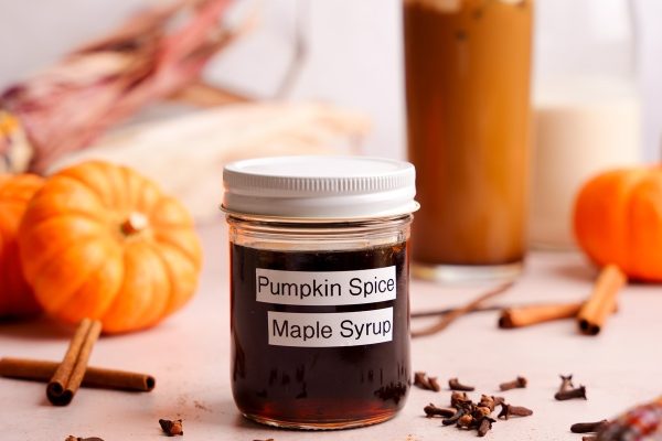 Pumpkin Spice Infused Maple Syrup in a covered jar. 