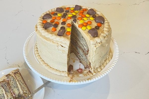Whole Peanut Butter and Jam Banana Cake on a cake serving dish.