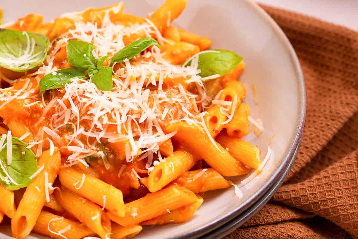 Penne pasta with tomato sauce and herbs.