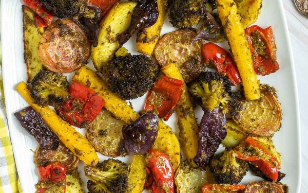 Pesto roasted vegetables on a tray.