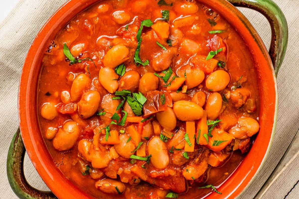 pinto bean soup in red bowl