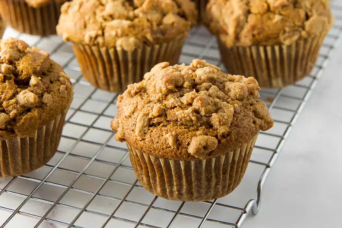 Pumpkin muffins on cooling rack.