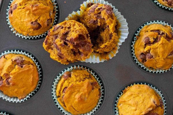 Pumpkin Banana Muffins on a muffin tin. 