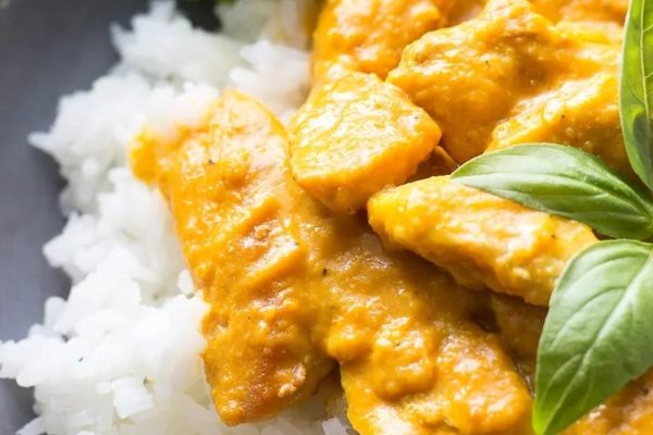Thai chicken curry with rice and basil.