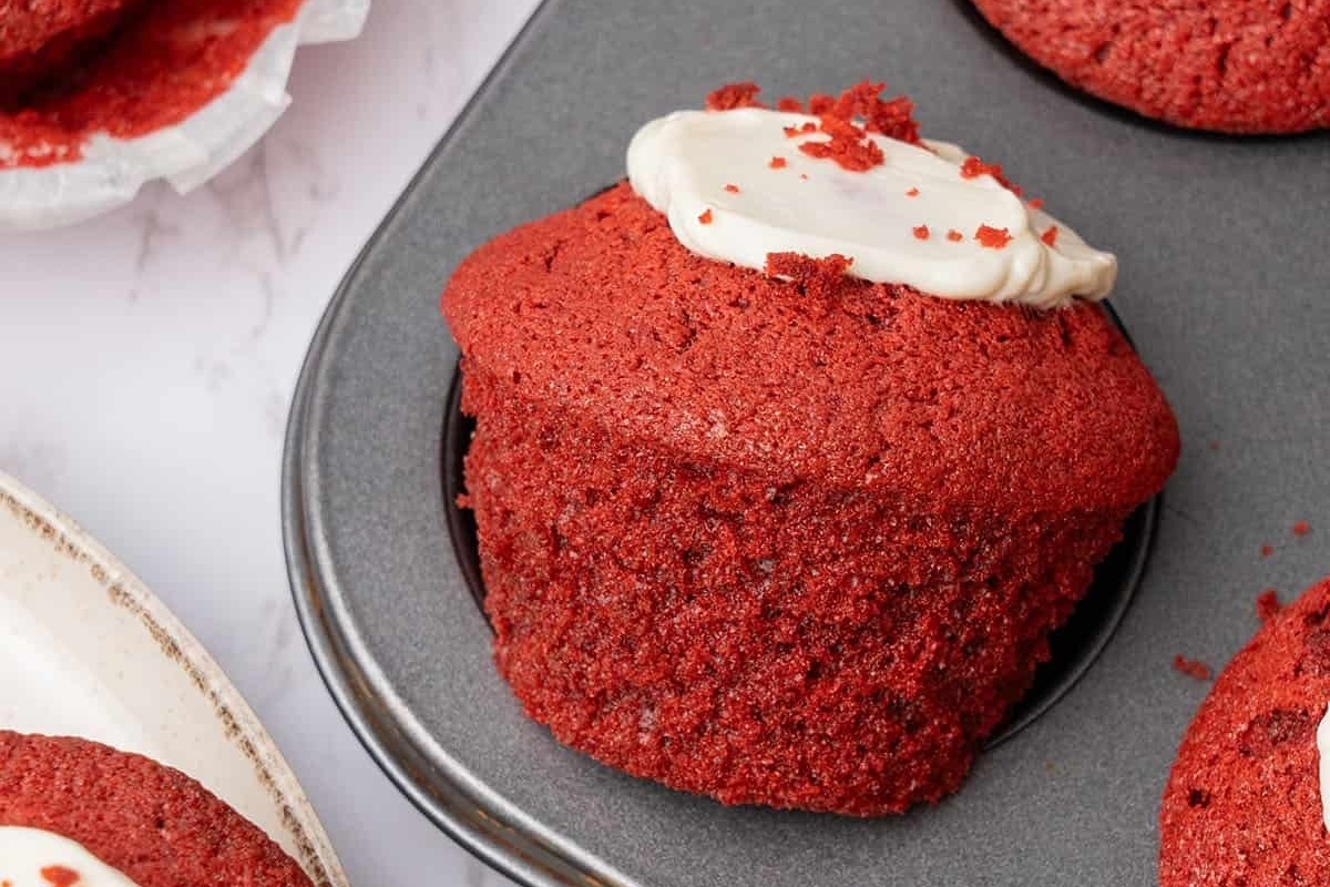Red velvet muffins in a baking tray.