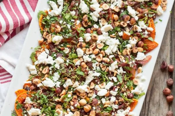 Roasted squash on a sheet pan with feta.