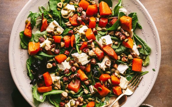 Squash salad with roasted vegetables in a big bowl. 