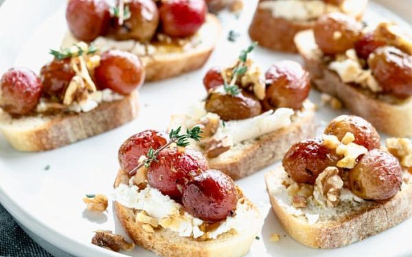 Crostini with grapes on top.