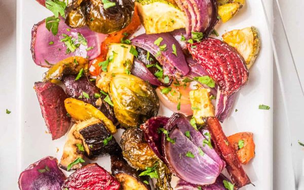 Mixed vegetables roasted on a sheet pan.