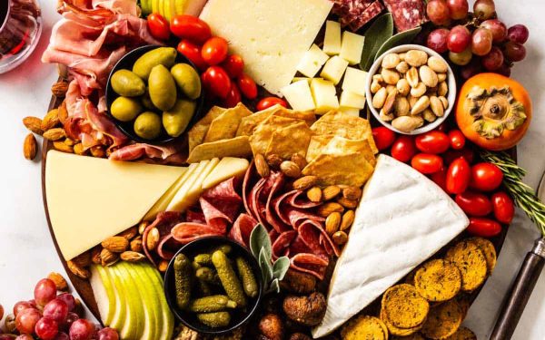 Board full of meat and cheese.
