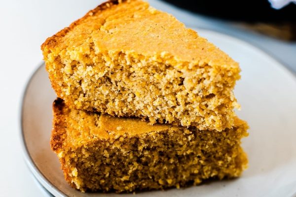 Spices of sweet cornbread on a white plate. 