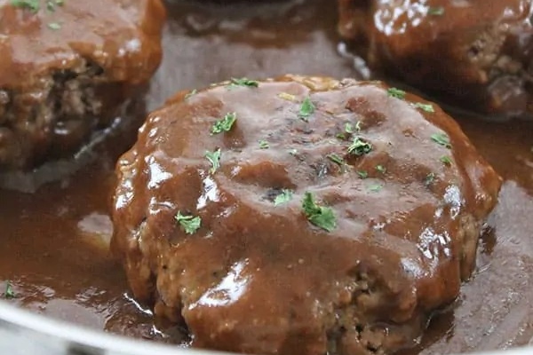 Salisbury Steak covered in sauce.