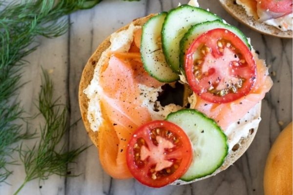Salmon Lox and Bagels with tomatoes and ccumbers.