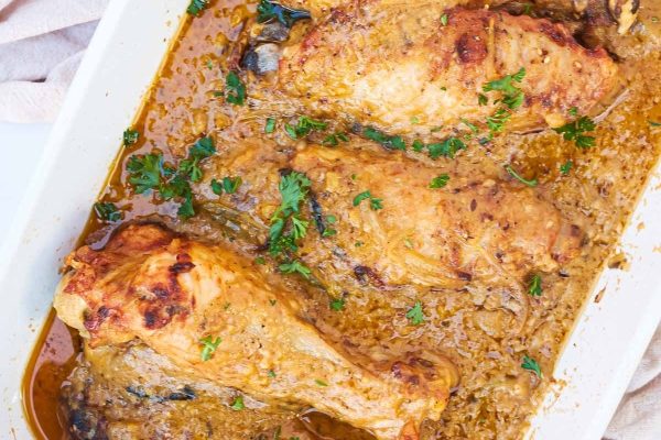 Turkey wings on a dish with sauce. 