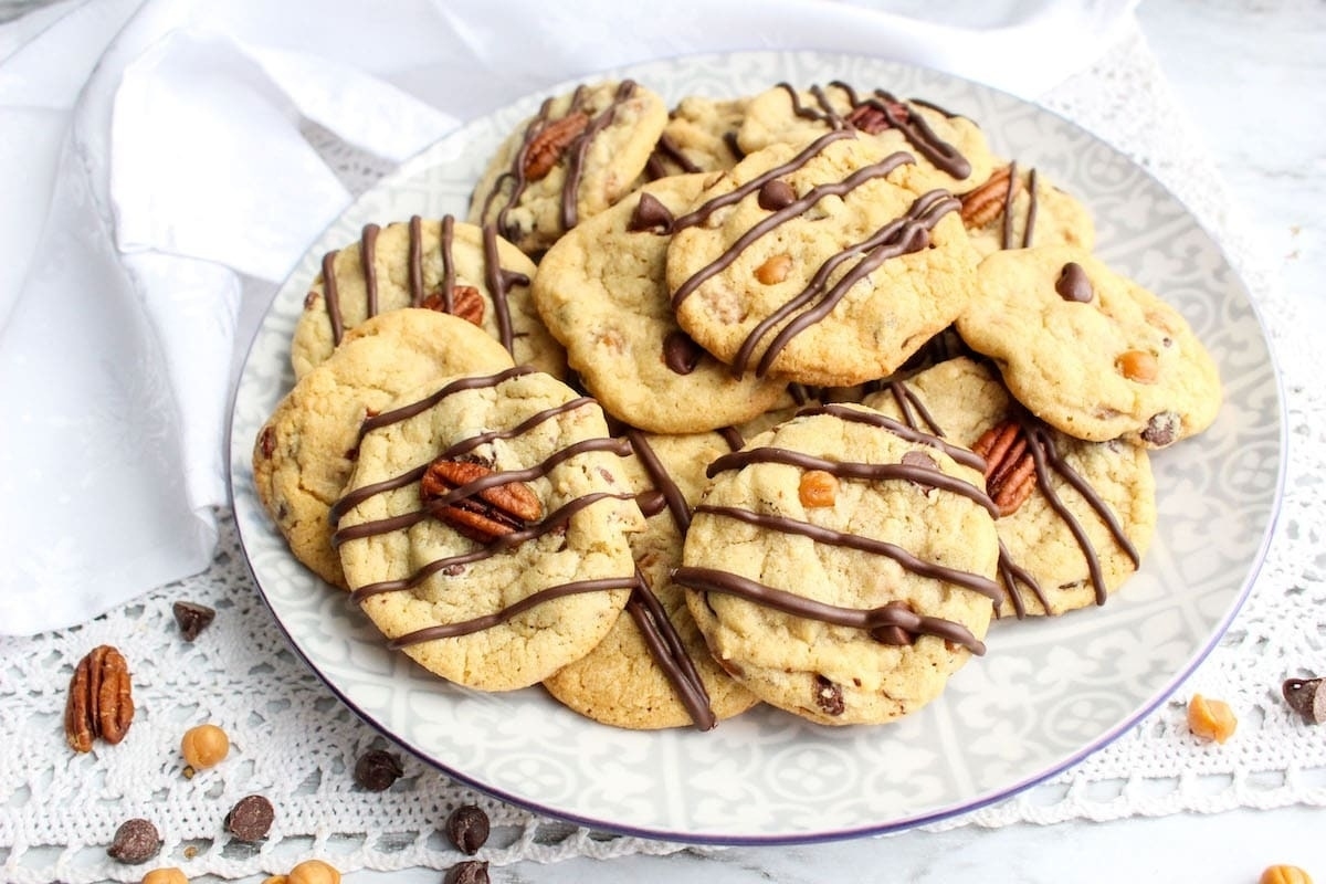 Pecan cookies drizzled with chocolate.