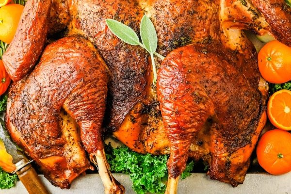 Spatchcock Grilled Turkey served with fruits and herbs. 