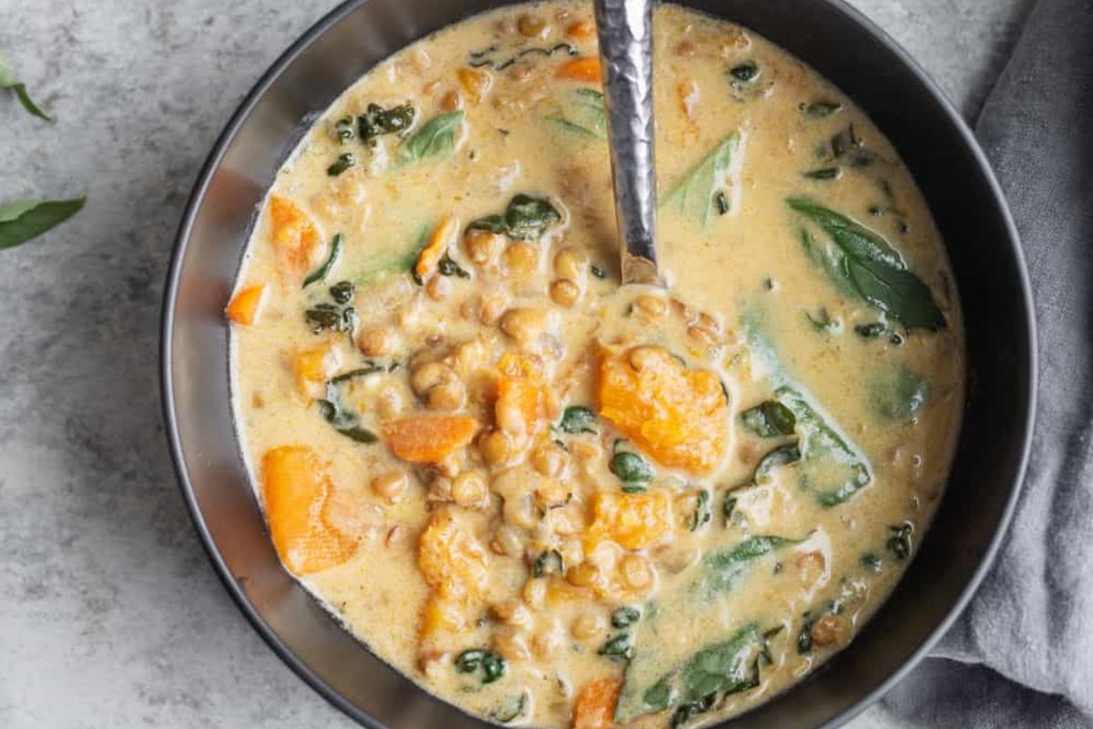 Spicy Thai Green Curry Soup in a bowl with lentils