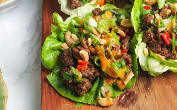 Korean beef on lettuce wraps with sauce.