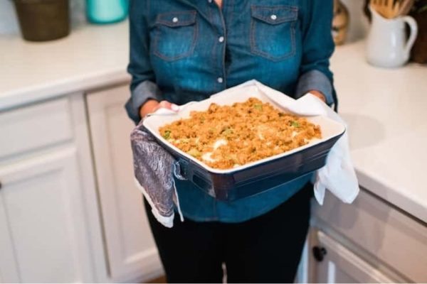 A casserole dish filled with leftover  baked turkey.